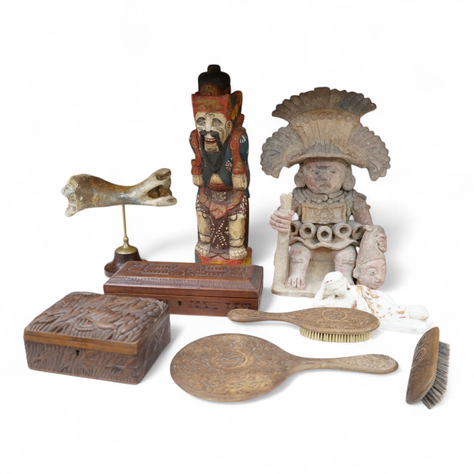 Eight south-east Asian carvings and a mounted bone, tallest 43cm